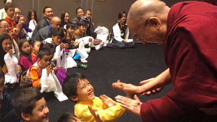 His Holiness the Dalai Lama playfully greeting young children as he arrives for his meeting with members of the Tibetan community and Tibet support groups in Malmö, Sweden on September 13, 2018. Photo by Tseten Samdup