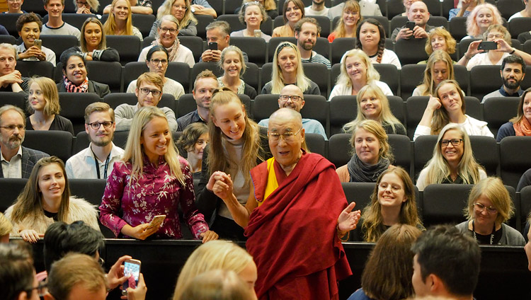 His Holiness the Dalai Lama posing for photos with members of the audience after his talk to students at Malmö University in Malmö, Sweden on September 13, 2018. Photo by Jeremy Russell