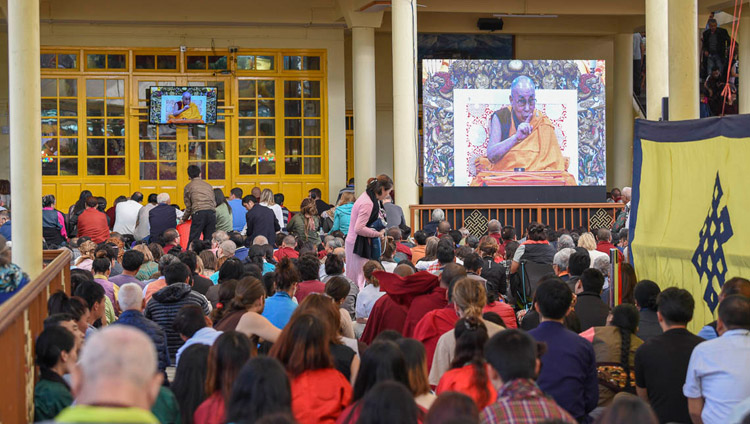 Many of the crowd gathered in the Main Tibetan Temple courtyard watching His Holiness the Dalai Lama's teaching on big screens in Dharamsala, HP, India on October 3, 2018. Photo by Tenzin Phende/DIIR