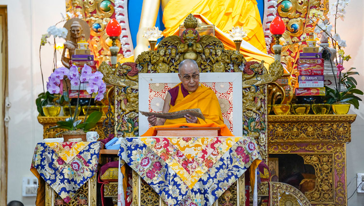 His Holiness the Dalai Lama reading from Chandrakirti's "Entering into the Middle Way" on the third day of teachings at the Main Tibetan Temple in Dharamsala, HP, India on October 5, 2018. Photo by Ven Tenzin Jamphel