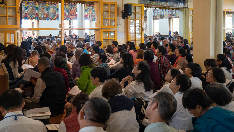 Members of the audience following the text on the final day of His Holiness the Dalai Lama's teaching at the Main Tibetan Temple in Dharamsala, HP, India on October 6, 2018. Photo by Ven Tenzin Jamphel