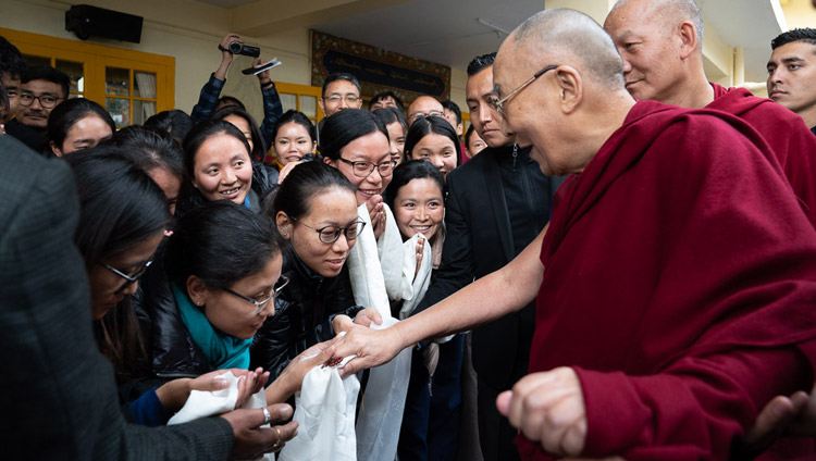 His Holiness the Dalai Lama interacting with members of the audience as he departs from the Main Tibetan Temple for his residence at the conclusion of the second day of the dialogue with Chinese scientists on quantum effects in Dharamsala, HP, India on November 2, 2018. Photo by Ven Tenzin Jamphel