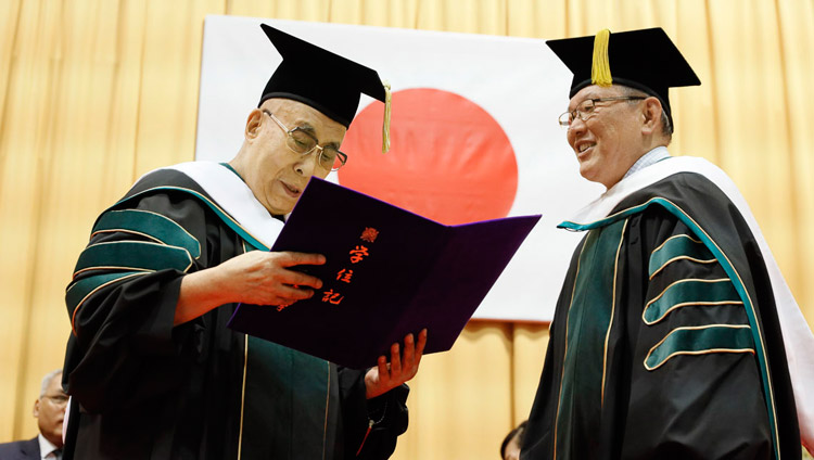 Reitaku University President Mototaka Hiroike presenting His Holiness the Dalai Lama an honorary Doctorate of Literature at Reitaku University in Chiba, Japan on November 19, 2018. Photo by Tenzin Jigme