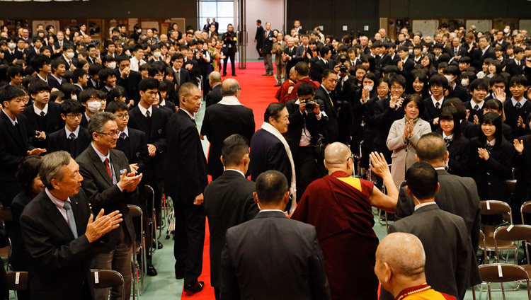 His Holiness the Dalai Lama greeting members of the audience as he makes his way out of the hall after his talk at Reitaku University in Chiba, Japan on November 19, 2018. Photo by Tenzin Jigme