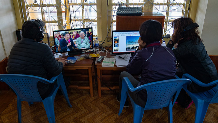 The Chinese language interpreters woking on the the third day of the Dialogue between His Holiness the Dalai Lama and Chinese Scientists on Quantum effects at the Main Tibetan Temple in Dharamsala, HP, India on November 3, 2018. Photo by Ven Tenzin Jamphel