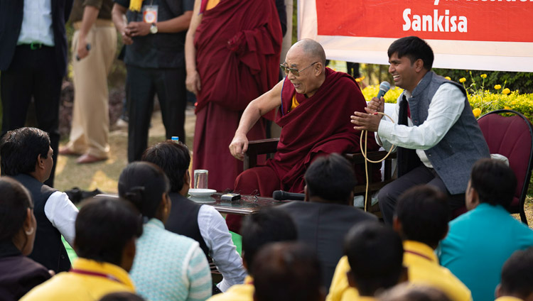 His Holiness the Dalai Lama interacting with volunteers of the Youth Buddhist Society on the lawn of his hotel in Sankisa, UP, India on December 2, 2018. Photo by Tenzin Choejor