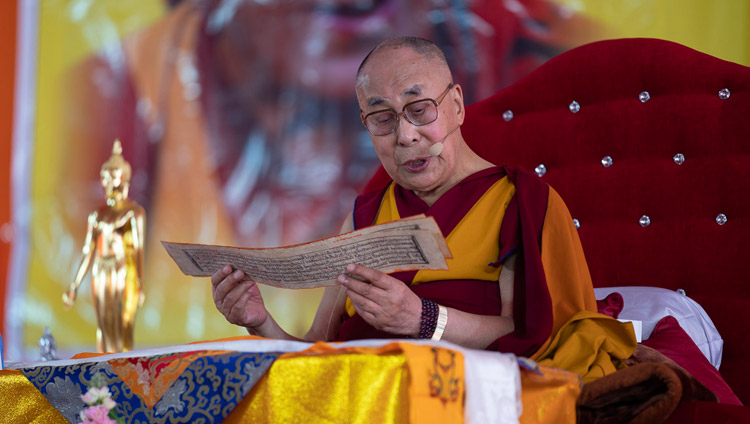 His Holiness the Dalai Lama reading from ‘Guide to the Bodhisattva’s Way of Life’ on the second day of his teaching in Sankisa, UP, India on December 4, 2018. Photo by Lobsang Tsering