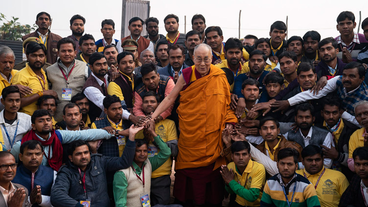 His Holiness the Dalai Lama with Youth Buddhist Society of India volunteers and organizers of his teaching in Sankisa, UP, India on December 5, 2018. Photo by Lobsang Tsering