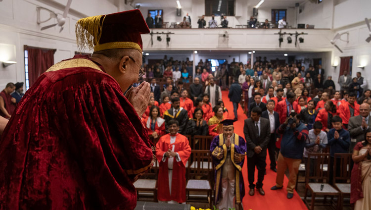 His Holiness the Dalai Lama bowing to the audience as he arrives on stage for Founder’s Day celebrations at St Stephen's College in New Delhi, India on December 7, 2018. Photo by Lobsang Tsering