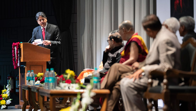 Former TV anchor Vikram Chandra reading a question from the audience for His Holiness the Dalai Lama during the 1st Yuvraj Krishan Memorial Lecture at Siri Fort Auditorium in New Delhi, India on December 8, 2018. Photo by Lobsang Tsering