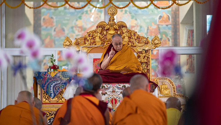 His Holiness the Dalai Lama reading from ‘The Thirty-seven Practices of Bodhisattvas’ on the first day of his teachings in Bodhgaya, Bihar, India on December 24, 2018. Photo by Lobsang Tsering
