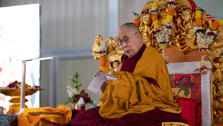 His Holiness the Dalai Lama reading from ‘37 Practices of Bodhisattvas' on the second day of his teachings in Bodhgaya, Bihar, India on December 25, 2018. Photo by Lobsang Tsering