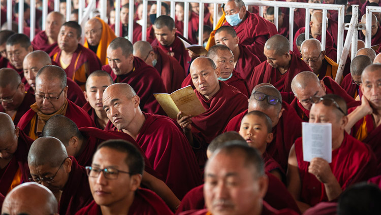 Some of the more than 8,000 monks and nuns in attendance following the text during the second day of His Holiness the Dalai Lama's teachings in Bodhgaya, Bihar, India on December 25, 2018. Photo by Lobsang Tsering