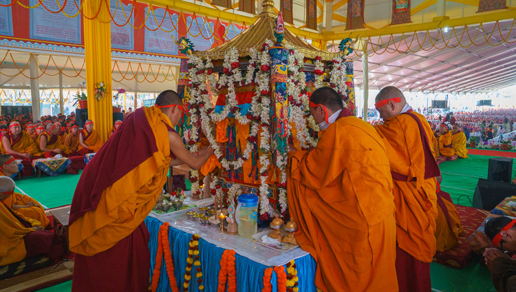 Namgyal Monastery monks opening the curtains of the mandala pavilion during the Solitary Hero Vajrabhairava Empowerment given by His Holiness the Dalai Lama at the Kalachakra Ground in Bodhgaya, Bihar, India on December 26, 2018. Photo by Lobsang Tsering