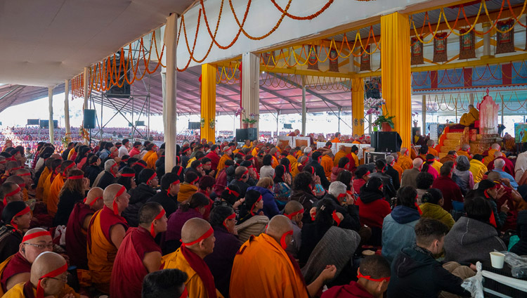 Wearing ritual blindfolds, the more than 15,000 attending the Solitary Hero Vajrabhairava Empowerment listen to His Holiness the Dalai Lama at the Kalachakra Ground in Bodhgaya, Bihar, India on December 26, 2018. Photo by Lobsang Tsering