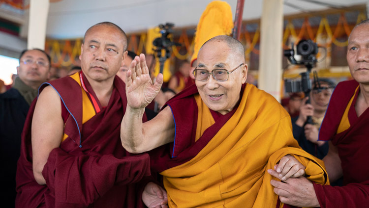 His Holiness the Dalai Lama waving to the crowd as he leaves the stage at the conclusion of the Long Life Ceremony at the Kalachakra Ground in Bodhgaya, Bihar, India on December 31, 2018. Photo by Lobsang Tsering