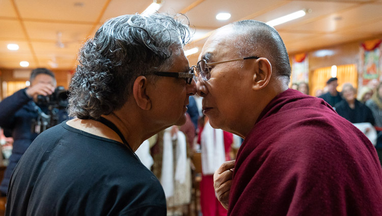 His Holiness the Dalai Lama greeting Deepak Chopra in the Maori style of rubbing noses at the start of their meeting at his residence in Dharamsala, HP, India on February 11, 2019. Photo by Tenzin Choejor