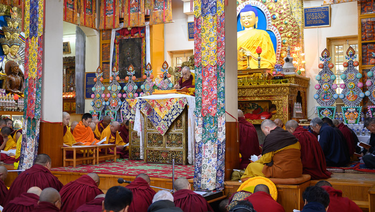 His Holiness the Dalai Lama reading from the texts during his teaching at the Main Tibetan Temple on the Day of Miracles in Dharamsala, HP, India on February 19, 2019. Photo by Tenzin Choejor