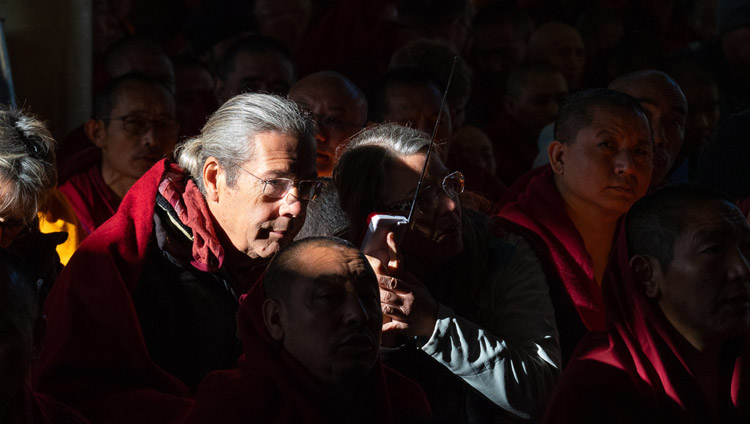 Members of the crowd listening to a translation of His Holiness the Dalai Lama's teaching at the Main Tibetan Temple in Dharamsala, HP, India on February 19, 2019. Photo by Tenzin Choejor Members of the crowd listening to a translation of His Holiness the Dalai Lama's teaching at the Main Tibetan Temple in Dharamsala, HP, India on February 19, 2019. Photo by Tenzin Choejor