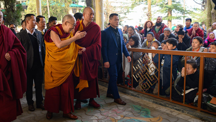 His Holiness the Dalai Lama greeting members of the crowd in the Main Tibetan Temple courtyard on the first day of his teaching on Bhavaviveka's "Essence of the Middle Way" in Dharamsala, HP, India on February 20, 2019. Photo by Tenzin Choejor