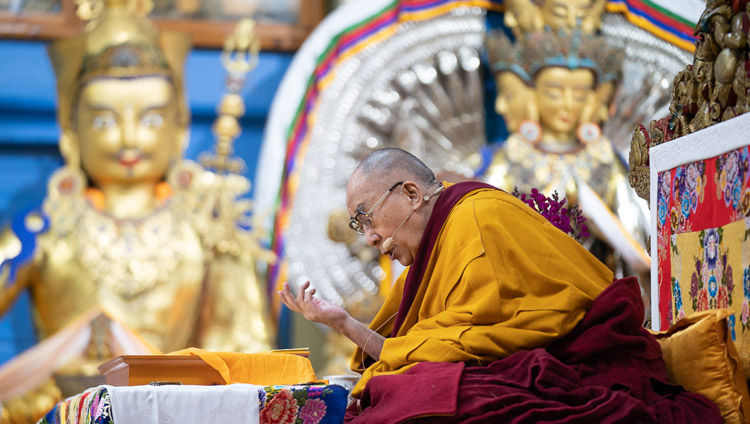 His Holiness the Dalai Lama reading from Bhavaviveka's "Essence of the Middle Way" on the first day of his teachings at the Main Tibetan Temple in Dharamsala, HP, India on February 20, 2019. Photo by Tenzin Choejor