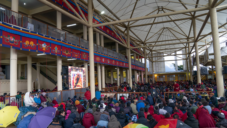 The crowd sitting in the courtyard of the Main Tibetan Temple watching His Holiness the Dalai Lama on big screens on the second day of his teaching in Dharamsala, HP, India on February 21, 2019. Photo by Tenzin Choejor