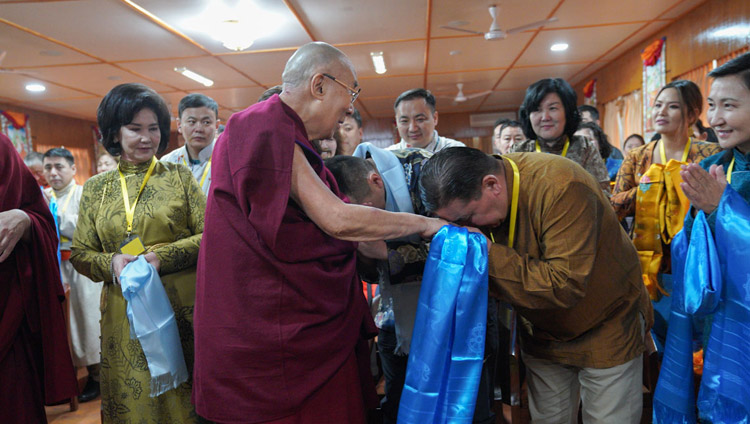 His Holiness the Dalai Lama greeting members of a group of young professionals from Mongolia as he arrives for their meeting as his residence in Dharamsala, HP, India on March 25, 2019. Photo by Tenzin Choejor