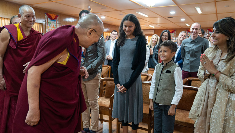 His Holiness the Dalai Lama greeting one of the younger members of a group from Singapore on his arrival for the meeting at his residence in Dharamsala, HP, India on March 27, 2019. Photo by Tenzin Choejor