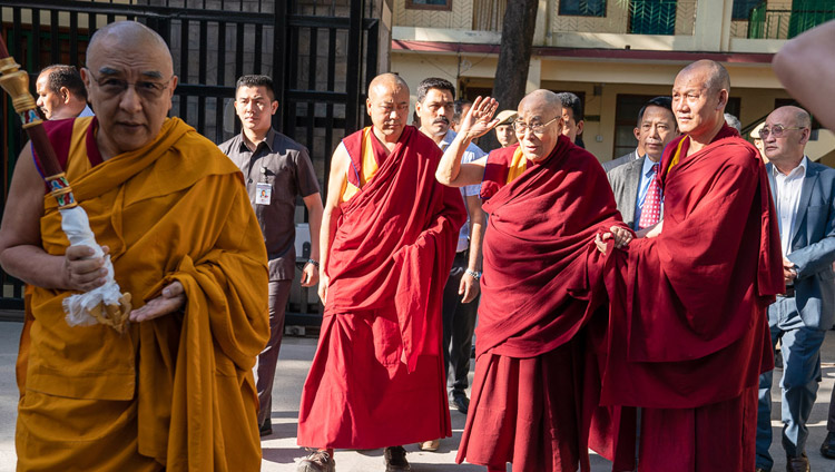 His Holiness the Dalai Lama waving to well-wishers gathered to greet him in the Main Tibetan Temple courtyard as he makes his way to the Kalachakra Temple in Dharamsala, HP, India on May 5, 2019. Photo by Tenzin Choejor