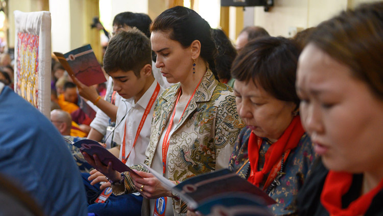 Members of the audience reciting prayers at the start of the second day of His Holiness the Dalai Lama's teaching at the request of Russian Buddhists at the Main Tibetan Temple in Dharamsala, HP, India on May 11, 2019. Photo by Tenzin Choejor