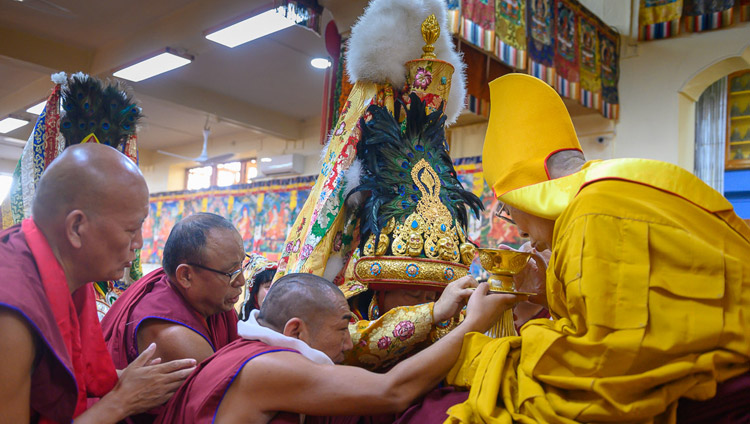 The Nechung Oracle offering ritual substances for the long life of His Holiness the Dalai Lama at the Main Tibetan Temple in Dharamsala, HP, India on May 17, 2019. Photo by Tenzin Choejor