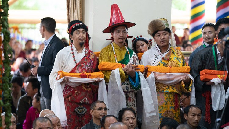 Members of the Tibetan community in the traditional dress of the three provinces of Tibet holding offering to present during the Long Life Offering Ceremony for His Holiness the Dalai Lama at the Main Tibetan Temple in Dharamsala, HP, India on May 17, 2019. Photo by Tenzin Choejor