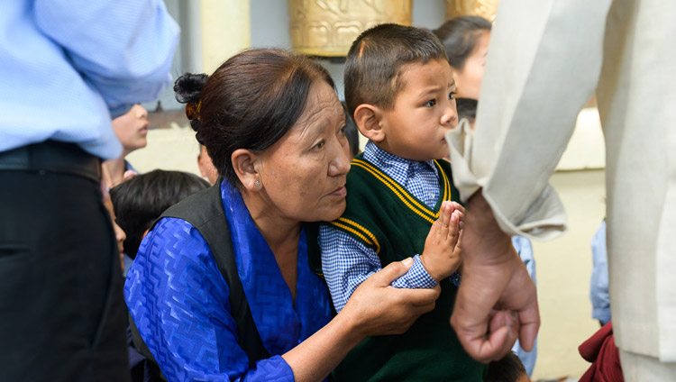 Young and old members of the Tibetan community watching as His Holiness the Dalai Lama arrives at the Main Tibetan Temple for his teaching for young Tibetans in Dharamsala, HP, India on June 3, 2019. Photo by Tenzin Choejor