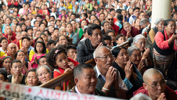 Some of the 11,000 attending the Avalokiteshvara Empowerment sitting in the courtyard of the Main Tibetan Temple watching His Holiness the Dalai Lama speaking in Dharamsala, HP, India on June 5, 2019. Photo by Tenzin Choejor