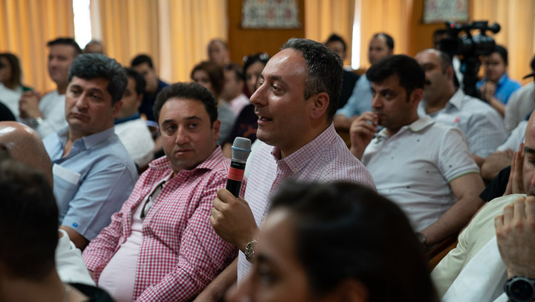 A member of the audience asking His Holiness the Dalai Lama during his meeting with members of a group from Iran at his residence in Dharamsala, HP, India on June 7, 2019. Photo by Tenzin Choejor