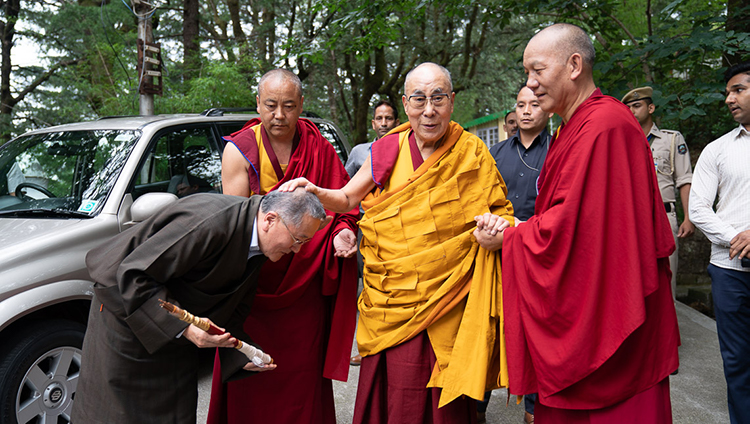 His Holiness the Dalai Lama affectionately greeting former Kalön Tripa, Tenzin Namgyal Tethong, as he makes his way from his residence to the Main Tibetan Temple in Dharamsala, HP, India on July 5, 2019. Photo by Tenzin Choejor