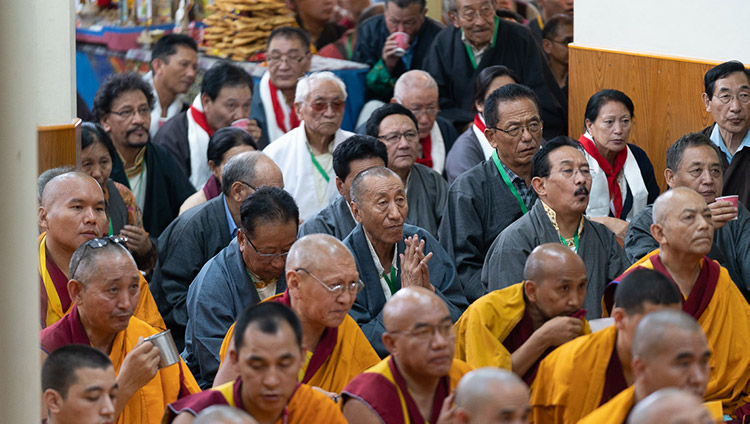 Retired CTA staff listening to His Holiness the Dalai Lama speaking during the Long Life Offering ceremony at the Main Tibetan Temple in Dharamsala, HP, India on July 5, 2019. Photo by Tenzin Choejor
