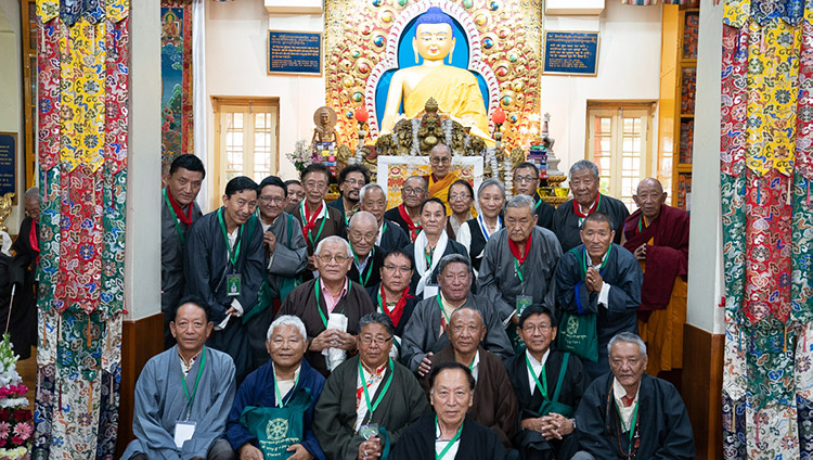His Holiness the Dalai Lama poses for a photo with former CTA officials at the conclusion of the Long Life Offering ceremony at the Main Tibetan Temple in Dharamsala, HP, India on July 5, 2019. Photo by Tenzin Choejor