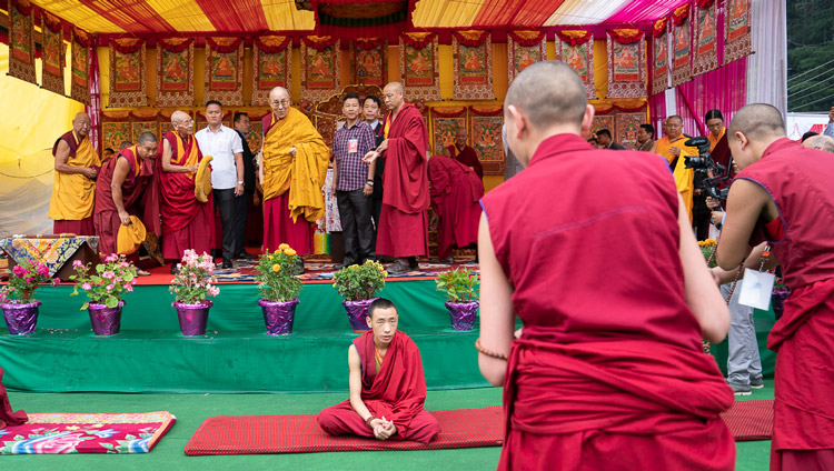 Monks debating in front of the stage as His Holiness the Dalai Lama arrives at the teaching venue in Manali, HP, India on August 13, 2019. Photo by Tenzin Choejor