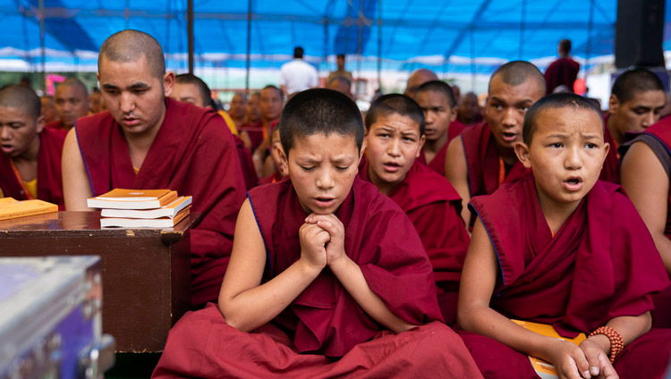 Young monks reciting prayers during the first day of His Holiness the Dalai Lama's teachings in Manali, HP, India on August 13, 2019. Photo by Tenzin Choejor