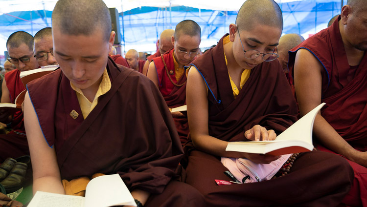 Nuns following the text during His Holiness the Dalai Lama's second day of teachings in Manali, HP, India on August 14, 2019. Photo by Tenzin Choejor