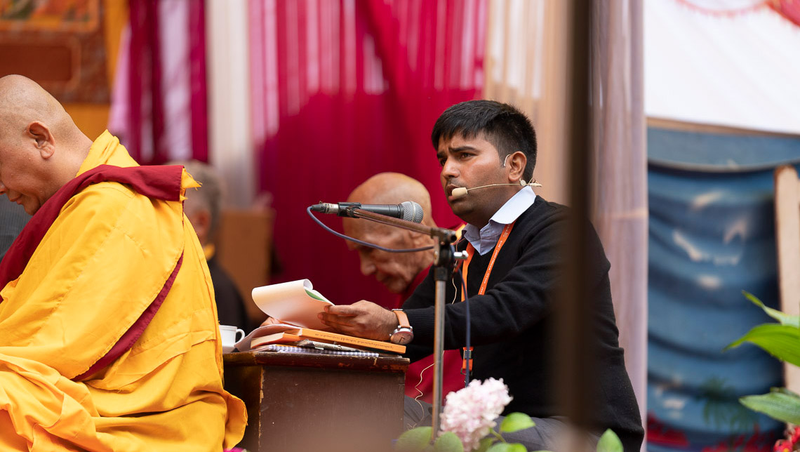 The Hindi interpreter translating His Holiness the Dalai Lama's comments on the second day of teachings in Manali, HP, India on August 14, 2019. Photo by Tenzin Choejor