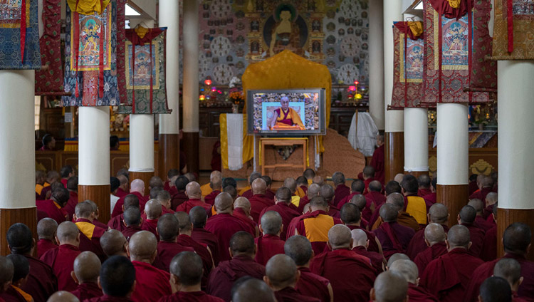 Members of the audience sitting in the Kalachakra Temple watching His Holiness the Dalai Lama on a TV during the second day of teachings in Dharamsala, HP, India on September 5, 2019. Photo by Matteo Passigato