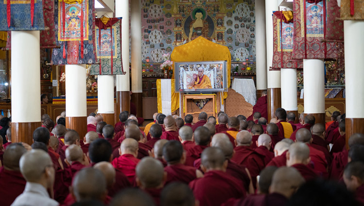 Monasitcs in the Kalachakra Temple watching His Holiness the Dalai Lama on a TV screen during the third day of his teachings in Dharamsala, HP, India on September 6, 2019. Photo by Matteo Passigato