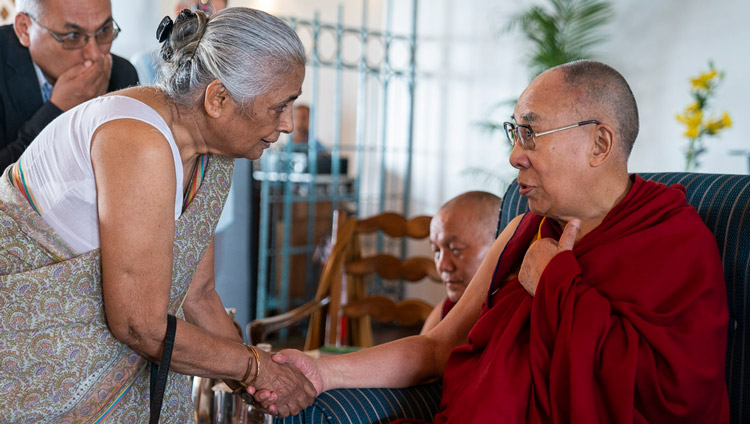 His Holiness the Dalai Lama greeting a member of the audience before his talk to intellectuals, academics and diplomats in New Delhi, India on September 21, 2019. Photo by Tenzin Choejor