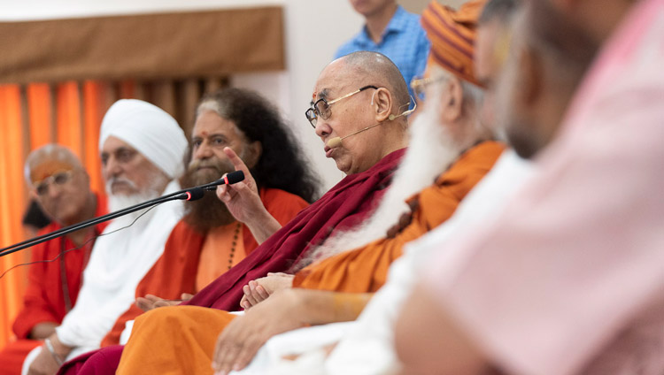 His Holiness the Dalai Lama speaking to members of the ashram in the auditorium at Sri Udasin Karshni Ashram in Mathura, UP, India on September 23, 2019. Photo by Tenzin Choejor