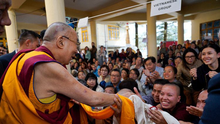 His Holiness the Dalai Lama greeting members of the audience os he departs the Main Tibetan Temple at the conclusion of the first day of his teaching in Dharamsala, HP, India on October 3, 2019. Photo by Ven Tenzin Jamphel