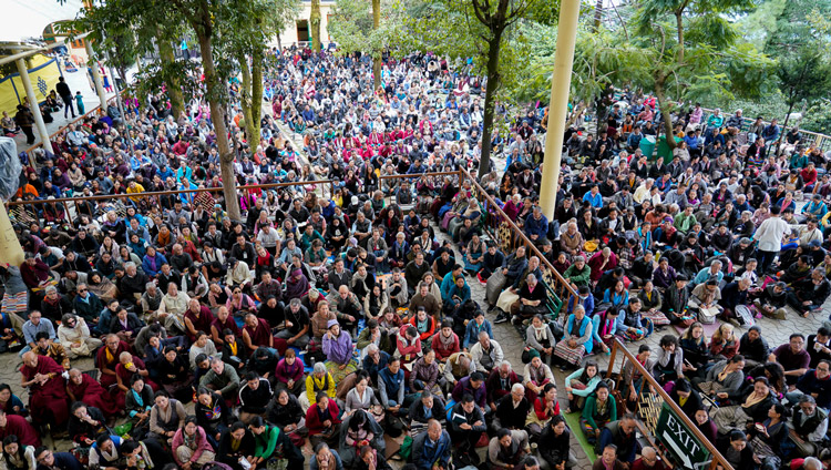 A view of the crowd in the courtyard of the Main Tibetan Temple watching His Holiness the Dalai Lama on big screens during the second day of teachings in Dharamsala, HP, India on October 4, 2019. Photo by Ven Tenzin Jamphel