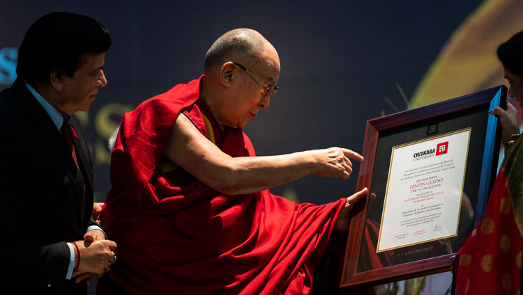 His Holiness the Dalai Lama holding the degree of Honorary Doctor of Literature presented by Chitkara University in Chandigarh, India on October 14, 2019. Photo by Tenzin Choejor