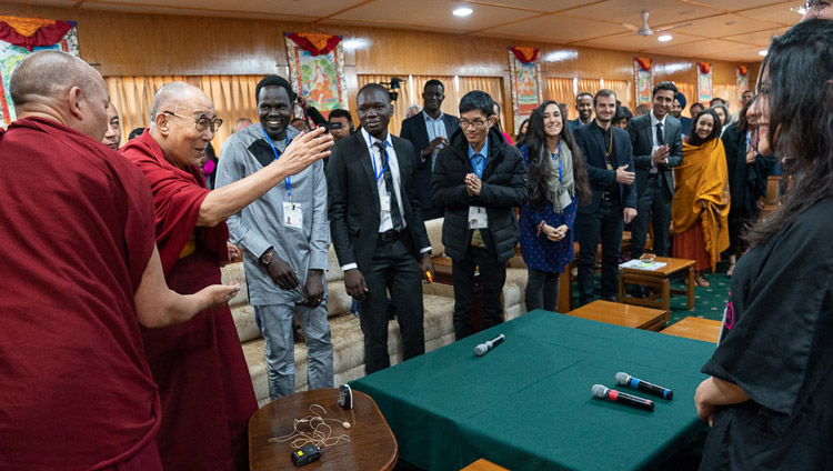 His Holiness the Dalai Lama greeting young people from conflict affected countries as he arrives for their conversation at his residence in Dharamsala, HP, India on October 23, 2019. Photo by Tenzin Choejor